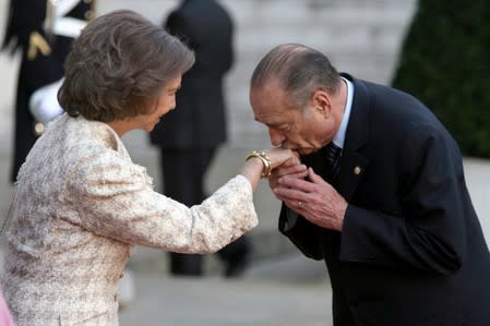 FILE PHOTO: File photo of French President Jacques Chirac kissing the hand of Spain's Queen Sofia upon her departure from the Elysee Palace in Paris