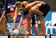 (On pool deck L-R) Melanie Schlanger, Bronte Barratt and Kylie Palmer of Australia celebrate with team mate Alicia Coutts (in pool) after they finished second in the Women's 4x200m Freestyle Relay on Day 5 of the London 2012 Olympic Games at the Aquatics Centre on August 1, 2012 in London, England. (Photo by Mike Hewitt/Getty Images)