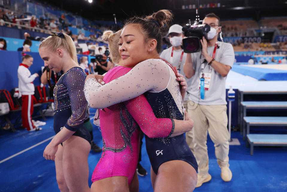 Sunisa Lee of Team United States hugs Angelina Melnikova of Team ROC during the Women's All-Around Final on day six of the Tokyo 2020 Olympic Games at Ariake Gymnastics Centre on July 29, 2021 in Tokyo, Japan.<span class="copyright">Jamie Squire—Getty Images</span>
