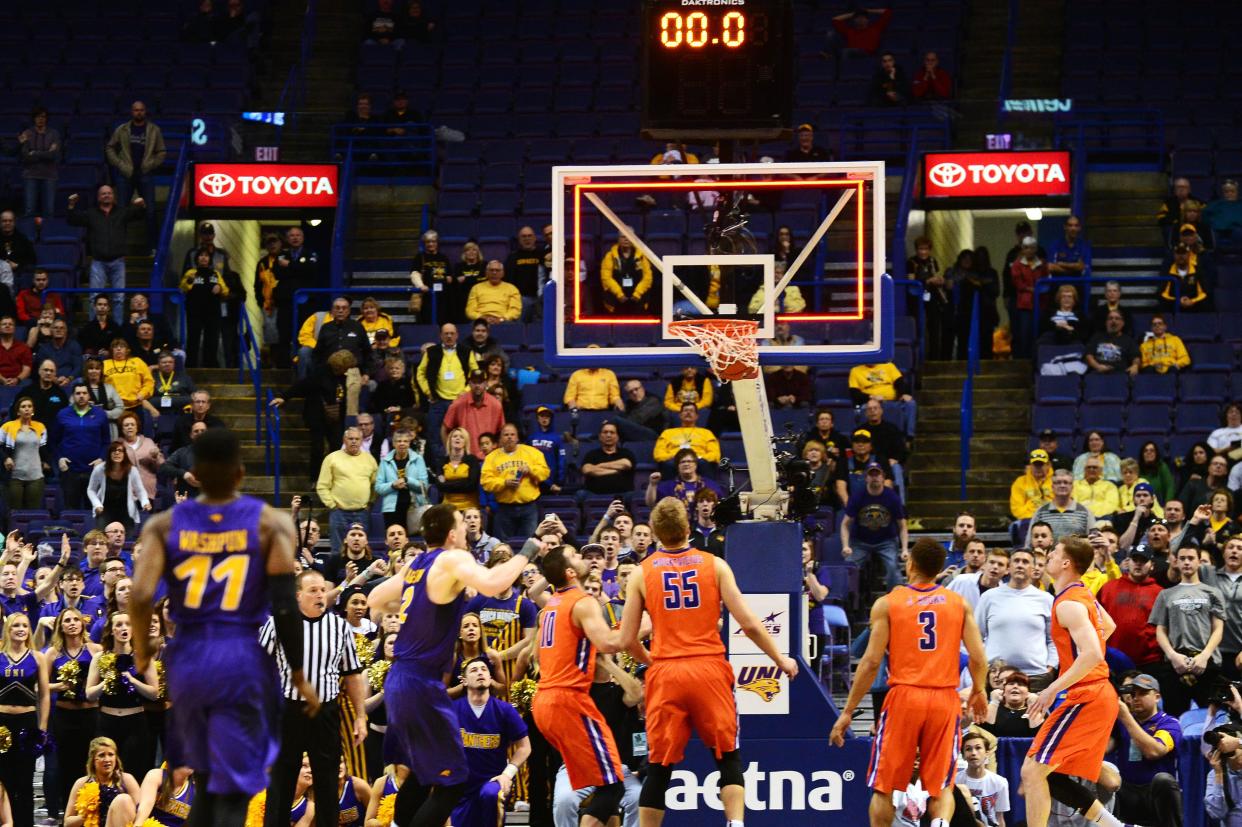 Mar 6, 2016; St. Louis, MO, USA; Northern Iowa Panthers guard Wes Washpun (11) watches his game winning shot at the buzzer go through the net to defeat the Evansville Aces in the championship game of the Missouri Valley Conference tournament at Scottrade Center. Northern Iowa defeated Evansville 56-54.