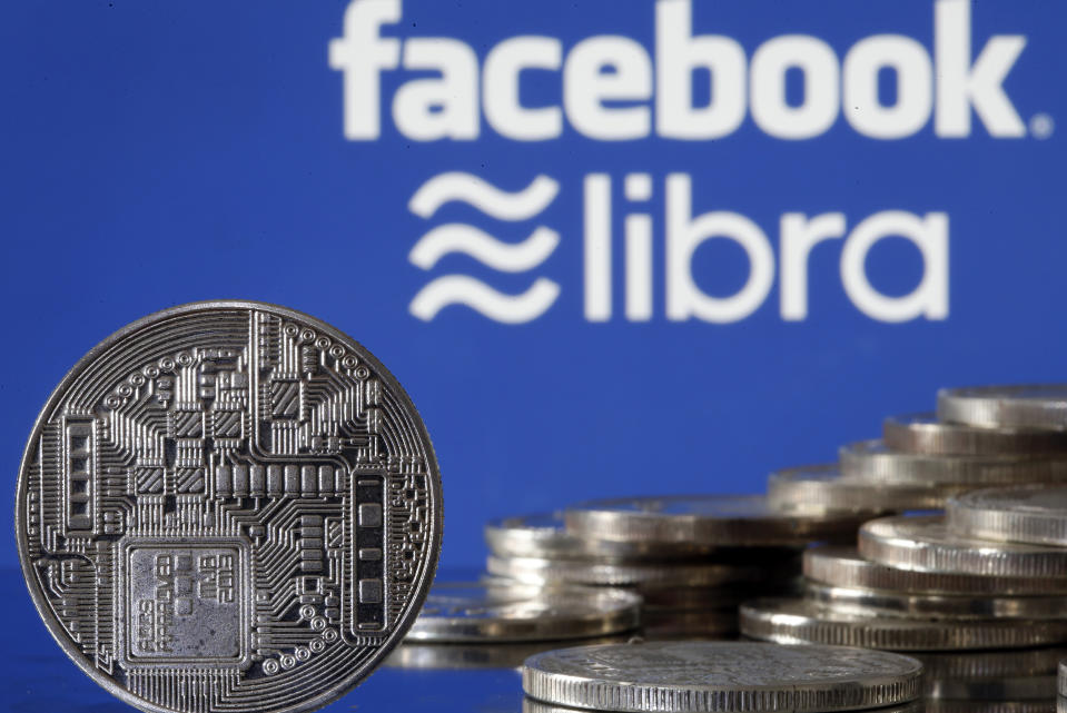 PARIS, FRANCE - JUNE 24: In this photo illustration, a visual representation of a digital cryptocurrency coin sits on display in front of Libra and Facebook logos on June 24, 2019 in Paris, France. Since the announcement of its creation a few days ago, the virtual currency of Facebook Libra fascinates as much as it worries. Thus, a few days after the announcement of the arrival of the social network in the sector, the Bank for International Settlements (BIS) considers that the incursion of major technologies into financial activity presents "new and complex compromises between financial stability , competition and data protection ". (Photo by Chesnot/Getty Images)