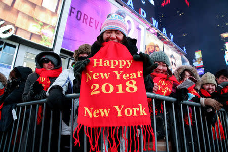 Revelers gather in Times Square ahead of the New Year's Eve celebrations in Manhattan, New York, U.S., December 31, 2017. REUTERS/Amr Alfiky