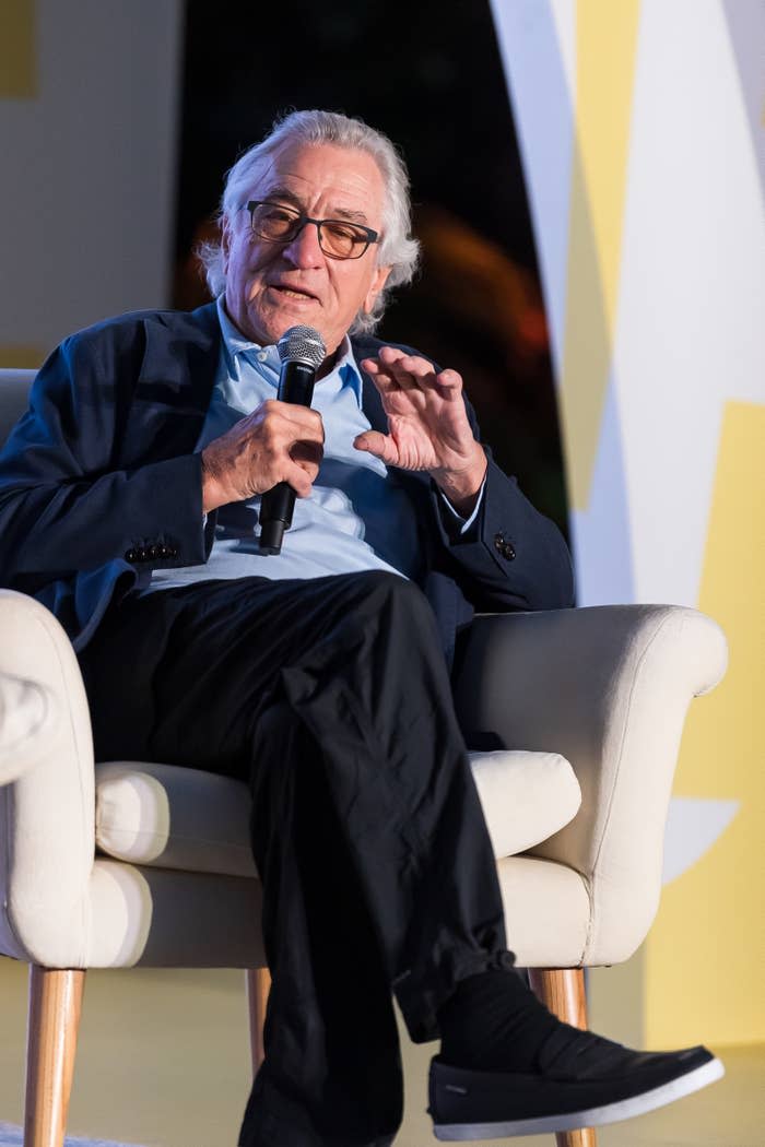 Close-up of Bob sitting and holding a microphone