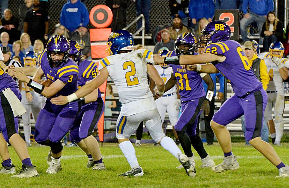 Watertown quarterback Alex Kahre (3) attempts to avoid a sack by Aberdeen Central's Will Heinert during their Eastern South Dakota Conference football game on Friday, Sept,. 30, 2022 at Watertown Stadium. Also pictured are Watertown's Brock Eitreim (58), Juven Hudson (31) and Chase Crocker (62).