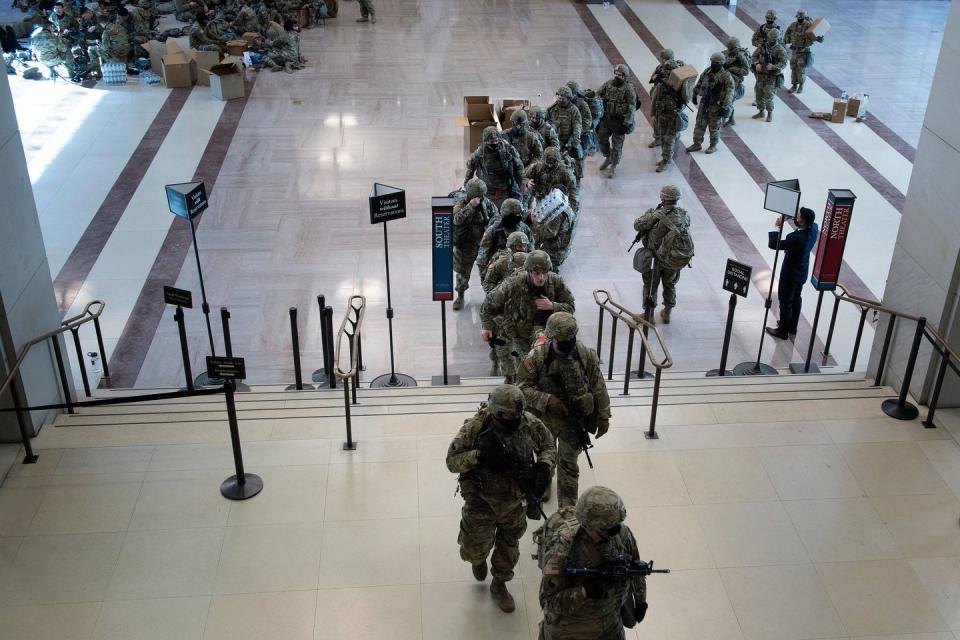 <p>Members of the National Guard deplaoy from the Capitol Visitors Center on Capitol Hill in Washington, DC, January 13, 2021.</p>