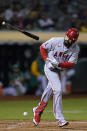 Los Angeles Angels' Anthony Rendon tosses his bat after being hit by a pitch thrown by Oakland Athletics starting pitcher Cole Irvin during the sixth inning of a baseball game in Oakland, Calif., Tuesday, Oct. 4, 2022. (AP Photo/Godofredo A. Vásquez)