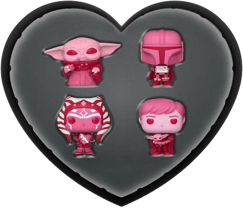 heart-shaped box with pink funko pops