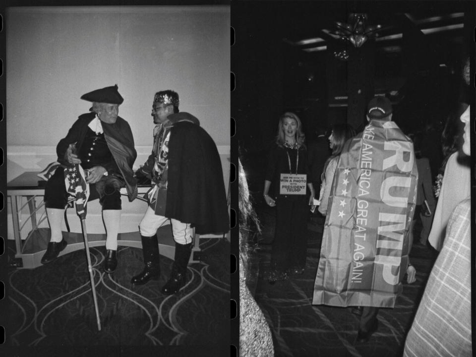 Two attendees dressed in costumes talk while taking a break from posing with pictures with attendees at CPAC. An attendee wearing a Trump flag as a cape walks through media row at CPAC in National Harbor, Md., on March 3, 2023.  (Frank Thorp V / NBC News)