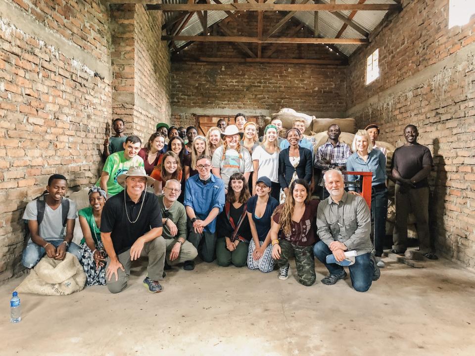 Askinosie Chocolate founder Shawn Askinosie, bottom right, poses with students from Chocolate University during a trip in the summer of 2018.