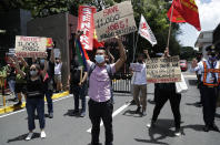 Supporters of the country's largest TV network ABS-CBN shout slogans during a rally outside the House of Representatives in metropolitan Manila, Philippines on Thursday, July 9, 2020. ABS-CBN was shut down by the government's telecommunications regulator in May after its 25-year franchise expired. Congress has been hearing the network's request for a franchise renewal. The shutdown has been criticized as it cut off a major source of information on the COVID-19 pandemic in a Southeast Asian hot spot of the disease. (AP Photo/Aaron Favila)