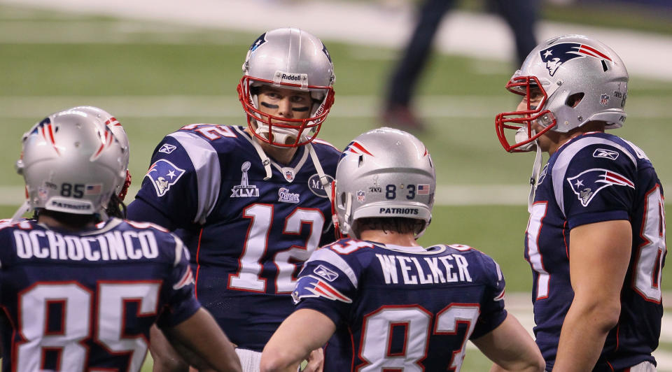 INDIANAPOLIS, IN - FEBRUARY 05: Tom Brady #12 of the New England Patriots works with his receivers on the field before the New England Patriots take on the New York Giants in Super Bowl XLVI at Lucas Oil Stadium on February 5, 2012 in Indianapolis, Indiana. (Photo by Jeff Gross/Getty Images)