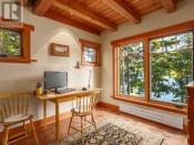 <p><span>3905 #407-3676 Horne Lake Caves Rd., Qualicum Beach, B.C.</span><br> You’ll find rustic touches throughout including a timber frame with nine-foot ceilings, custom-built cabinetry, alder flooring and solid fir doors.<br> (Photo: Zoocasa) </p>