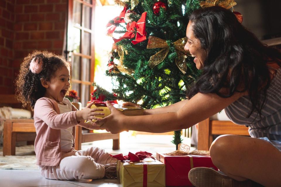 mother giving daughter christmas present