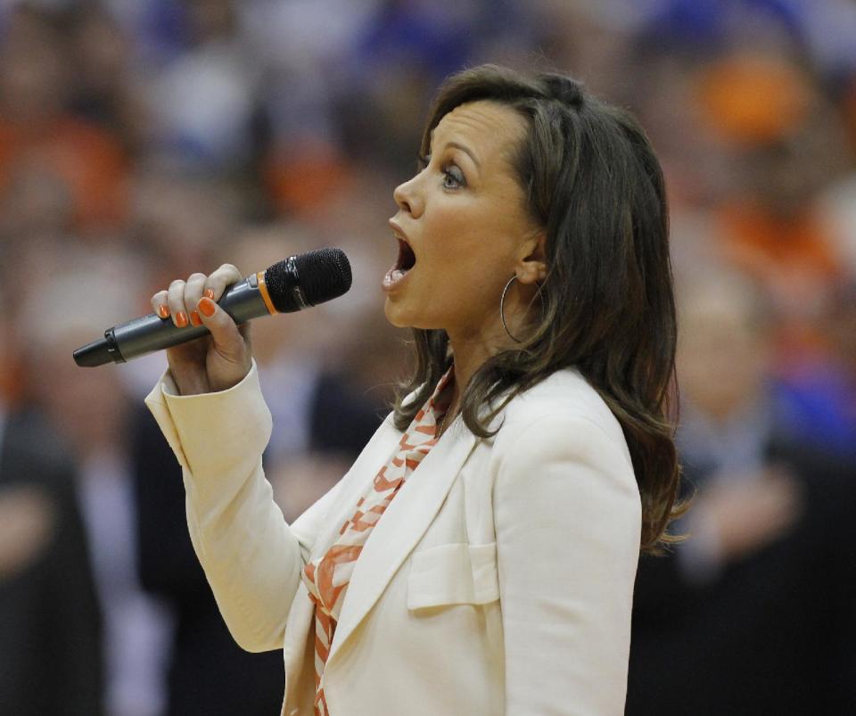 Syracuse alumna and former Miss America Vanessa Williams sings the national anthem before the Syracuse against Duke NCAA college basketball game in Syracuse, N.Y., Saturday, Feb. 1, 2014. (AP Photo/Nick Lisi)