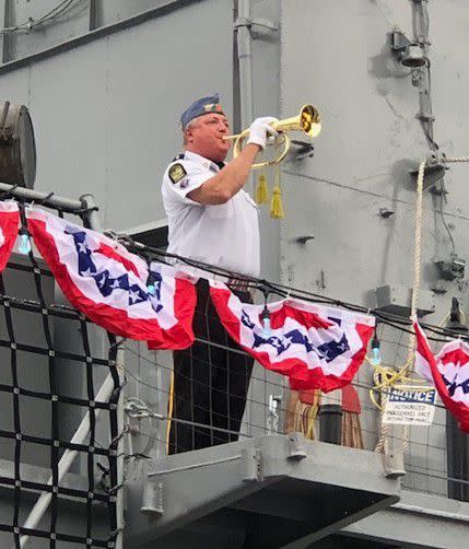 Bugler aboard USS Orleck honoring fallen soldiers of the Korean War.