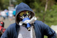 A masked demonstrator takes part in a protest against Nicaraguan President Daniel Ortega's government in Managua, Nicaragua September 23, 2018. REUTERS/Oswaldo Rivas