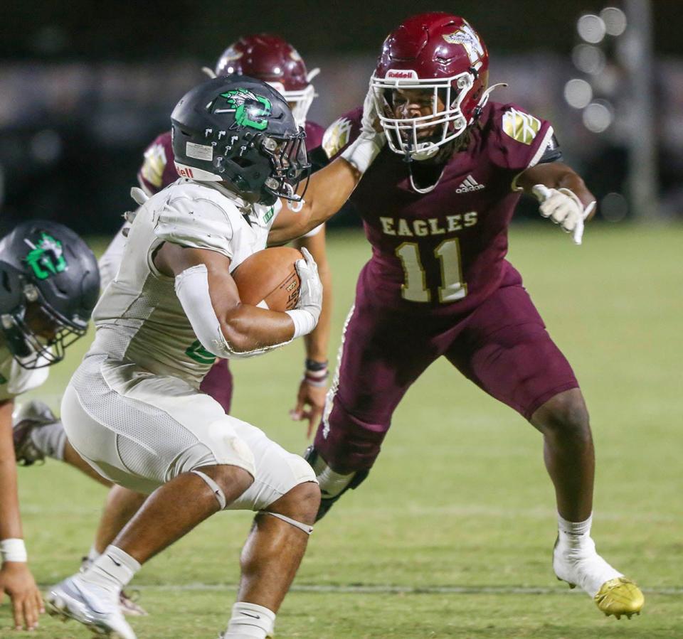 Choctaw RB Cole Tabb tries to fend off the tackle of Niceville LB Demontre Allen during the Choctaw-Niceville football game played at Niceville.