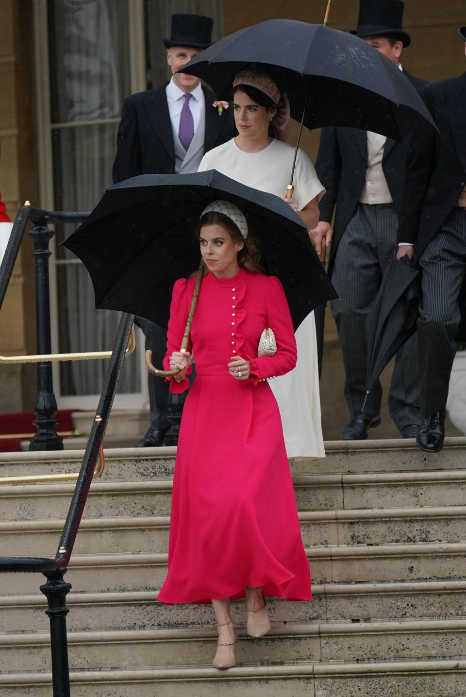 Princess Beatrice (front) and Princess Eugenie arrive for the Sovereign's Garden Party at Buckingham Palace on May 21, 2024 in London, England. (Photo by Yui Mok-WPA Pool/Getty Images)