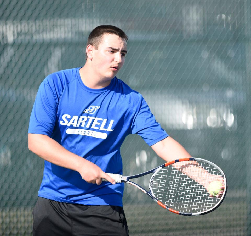 Sartell junior Zak Farley waits to serve Tuesday, April 26, 2022, at Tech High School.