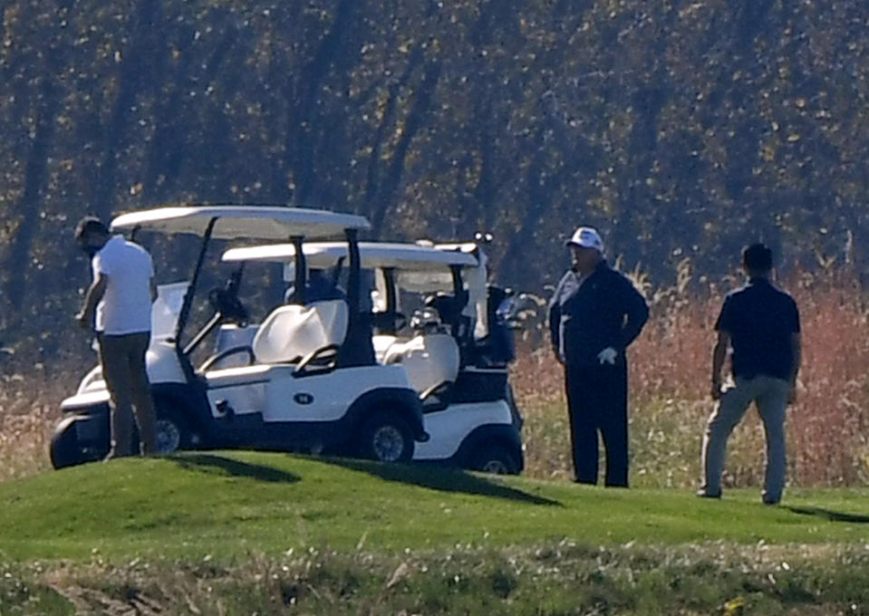 US President Donald Trump (2nd R) golfs at Trump National Golf Club on November 7, 2020 in Sterling, Virginia. - Democrat Joe Biden has won the White House, US media said November 7, defeating Donald Trump and ending a presidency that convulsed American politics, shocked the world and left the United States more divided than at any time in decades. (Photo by Olivier DOULIERY / AFP) (Photo by OLIVIER DOULIERY/AFP via Getty Images)