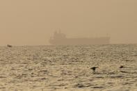 The oil tanker Mercer Street, which came under attack last week off Oman, is seen moored off Fujairah, United Arab Emirates, Wednesday, Aug. 4, 2021. The British navy warned of a "potential hijack" of another ship off the coast of the United Arab Emirates in the Gulf of Oman on Tuesday, though the circumstances remain unclear. (AP Photo/Jon Gambrell)