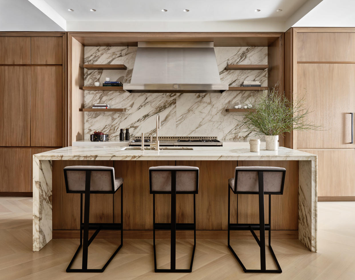  A kitchen with tall stools as island seating. 