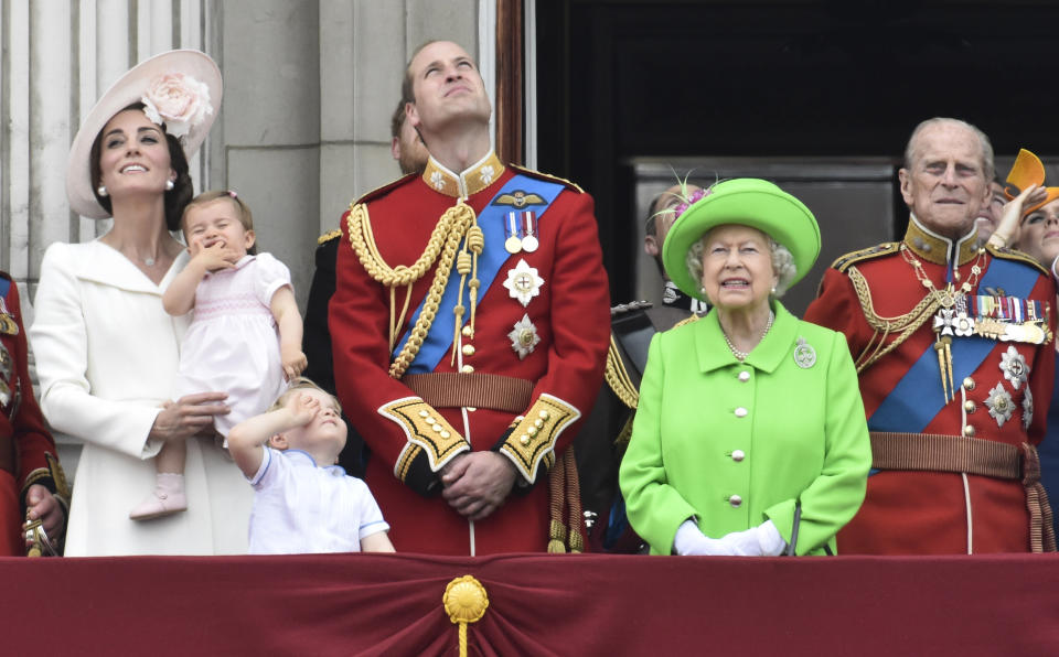 Members of the royal family, including Catherine, Duchess of Cambridge holding Princess Charlotte, Prince George, Prince William, Queen Elizabeth, and Prince Philip stand on the balcony of Buckingham Palace after the annual Trooping the Colour ceremony on Horseguards Parade in central London, Britain June 11, 2016. Trooping the Colour is a ceremony to honour Queen Elizabeth's official birthday. The Queen celebrates her 90th birthday this year.   REUTERS/Toby Melville 