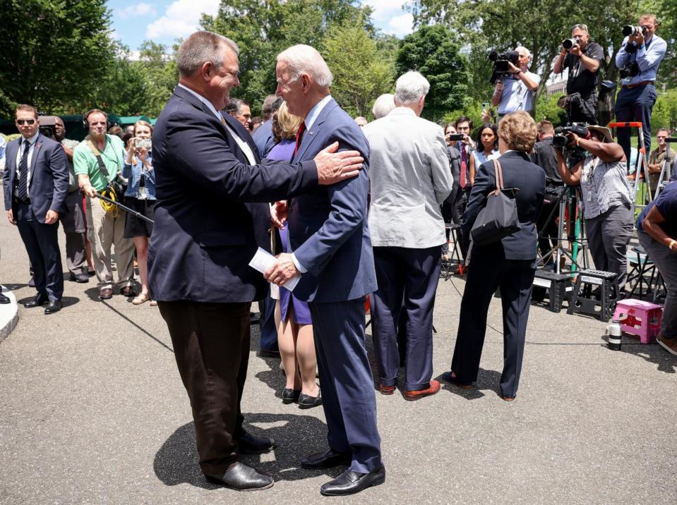 PHOTO: In this June 24, 2021, file photo, President Joe Biden talks to Sen. Jon Tester after speaking alongside a bipartisan group of Senators after the group reached a deal on an infrastructure package at the White House, in Washington, D.C.  (Kevin Dietsch/Getty Images, FILE)