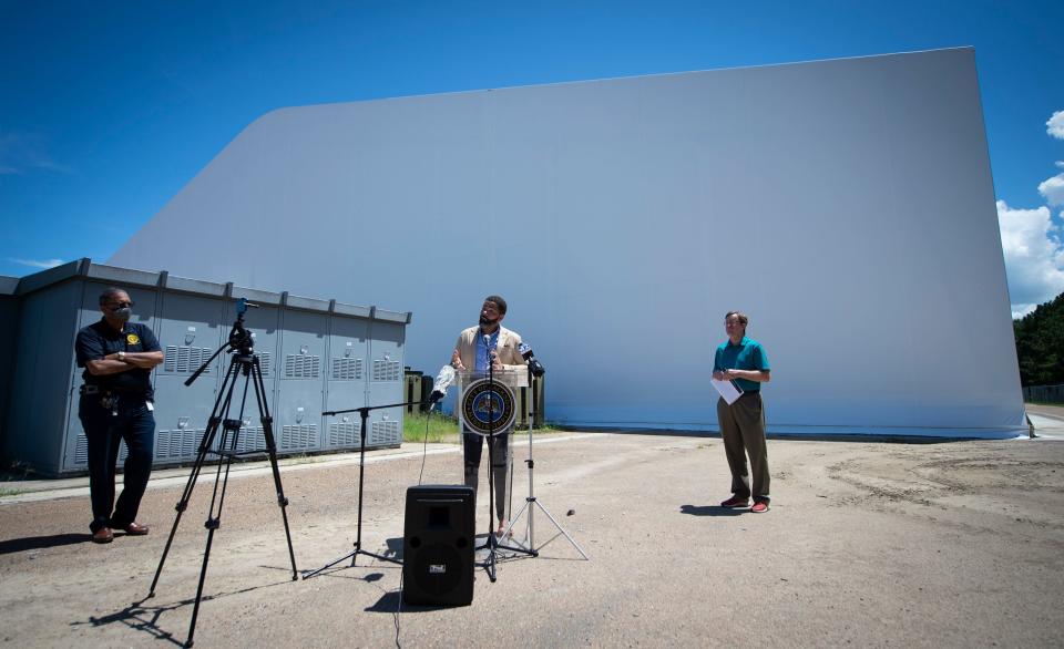 Jackson Mayor Chokwe Antar Lumumba, center, gives an update on water treatment issues in the city during a news conference at the O.B. Curtis Water Treatment Plant in Ridgeland, Miss., Monday, Aug. 8, 2022. Behind Mayor Lumumba is the nearly-completed weatherization cover built over the water filtration system in response to the hard freeze last winter that shut down most of the plant.