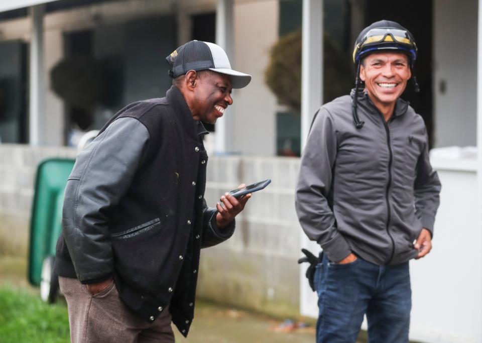 Jockey Jesus Castanon laughs while he and trainer Larry Demeritte talk to Harry Veruchi, owner of West Saratoga, after the gray colt's morning workout April 19, 2024 at Keeneland race track. West Saratoga is one of the 2024 Kentucky Derby horses; it's the first Kentucky Derby for Demeritte. Jesus Castanon rode Shackleford to a fourth-place finish in the 2011 Kentucky Derby.
