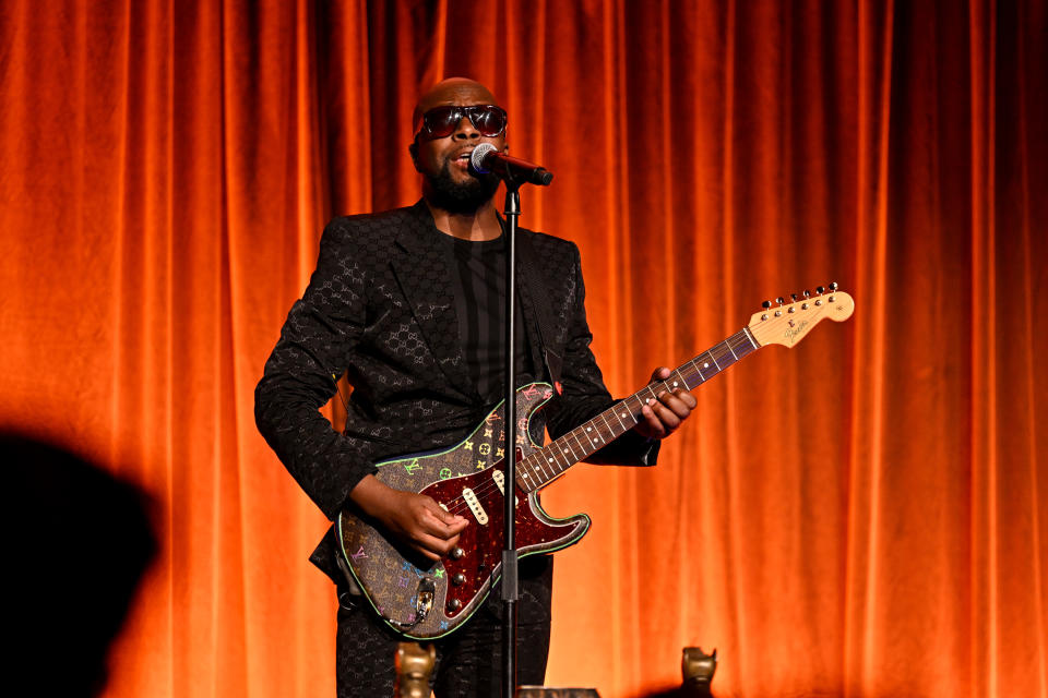 Wyclef Jean Playing Guitar