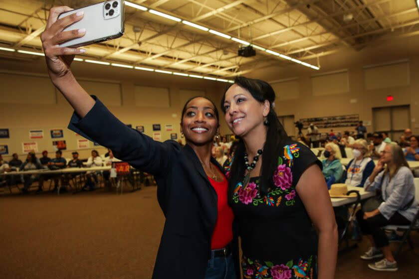 Bakersfield, CA - October 22: Malia Cohen, running for State Controller, left, takes a selfie with Kern county supervisor Leticia Perez, running for state assembly, at a campaign event held for assemblyman Rudy Salas at IBEW Local 428 on Saturday, Oct. 22, 2022 in Bakersfield, CA. (Irfan Khan / Los Angeles Times)