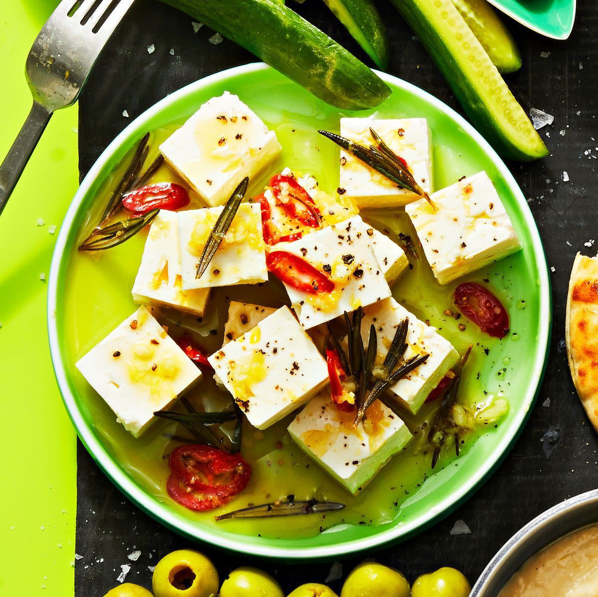 marinated feta cheese on a green plate