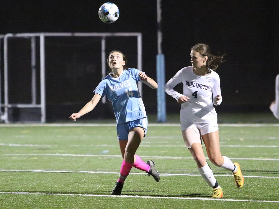 South Burlington's Oakley Machanic and Burlington's Brooks DeShaw look to gain possession during the 2022 high school girls soccer season.