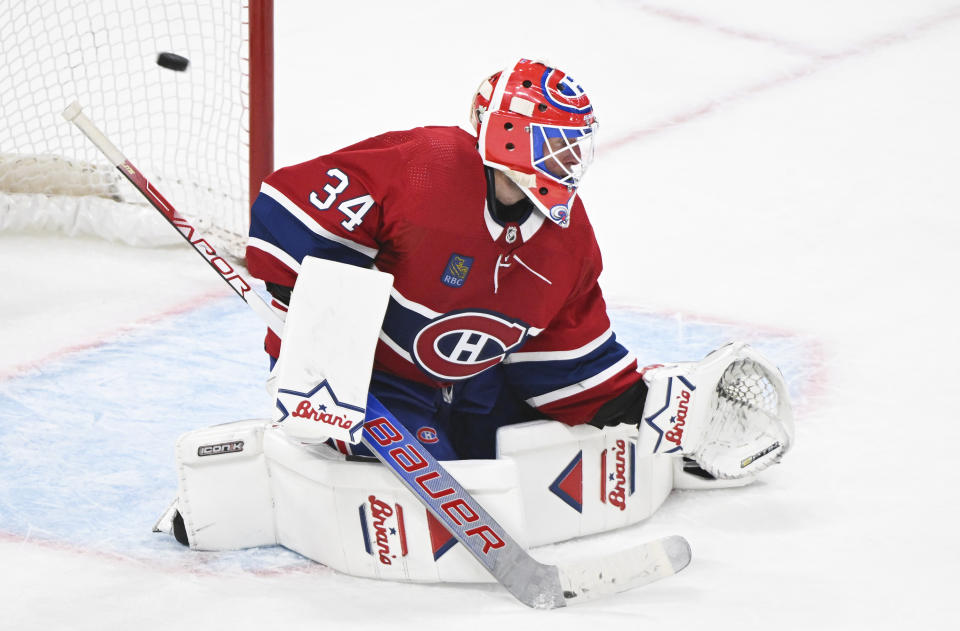Montreal Canadiens goaltender Jake Allen is scored on by Detroit Red Wings' Jake Walman during overtime in an NHL hockey game, Saturday, Dec. 2, 2023 in Montreal. (Graham Hughes/The Canadian Press via AP)