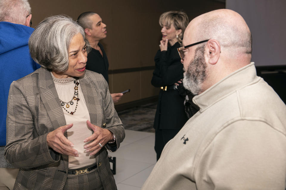 Terri Jamison, Democratic candidate for the Ohio Supreme Court, left, speaks with Waleed Abukhaled of Kent, Ohio, at a candidates forum sponsored by the Arab American Voter Project and the Council on American-Islamic Relations in Cleveland, Wednesday, March 6, 2024. Jamison is currently an Ohio Court of Appeals Judge. The Ohio Supreme Court’s 4-3 Republican majority could flip to Democrats’ favor in the fall if the party sweeps the three seats up for election this year. (AP Photo/Phil Long)