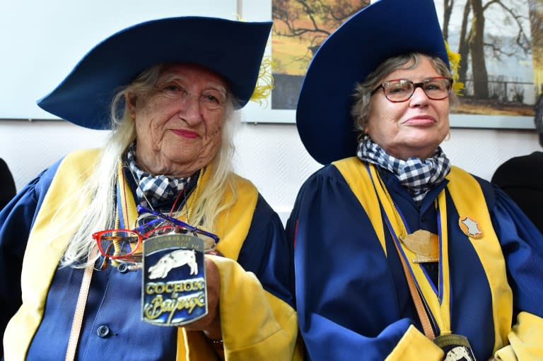 Marie-Chantal Eudine (L) and fellow grand mistress Nicole Levieux are members of the Bayeux pig society who also attended the annual general meeting of the tripe brotherhood of Ferte-Mace as guests