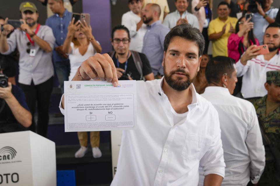 Presidential candidate Jan Topic, of the Country Without Fear Coalition, shows his ballot in a referendum on whether the country should ban oil operations in the Amazons during in a snap election in Guayaquil, Ecuador, Sunday, Aug. 20, 2023. In a historic decision, Ecuadorians voted on Sunday against the oil drilling of Yasuni National Park, which is a protected area in the Amazon that's home to two uncontacted tribes and serves as a biodiversity hotspot. (AP Photo/Martin Mejia, File)