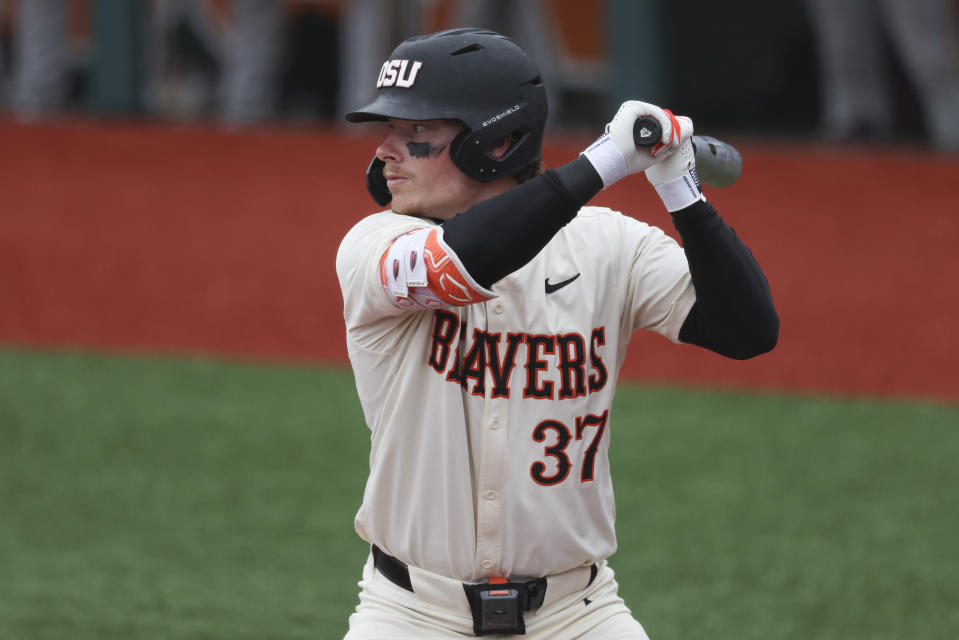 FILE - Oregon State infielder Travis Bazzana (37) bats during an NCAA baseball game against Arizona State on Saturday, April 6, 2024, in Corvallis, Ore. The field for the NCAA baseball tournament will take shape this week with conference tournaments determining most of the 30 automatic qualifiers. (AP Photo/Amanda Loman, File)