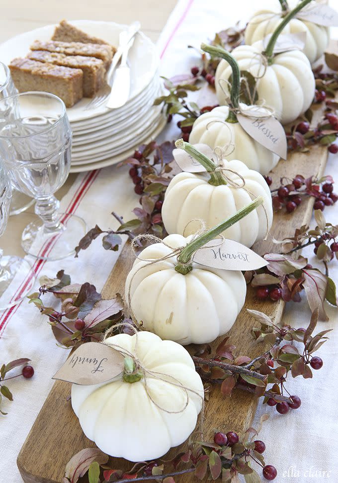 <p>This centerpiece by Kristen at <a rel="nofollow noopener" href="http://www.ellaclaireinspired.com/pumpkin-leaves-free-printable/" target="_blank" data-ylk="slk:Ella Claire;elm:context_link;itc:0;sec:content-canvas" class="link ">Ella Claire</a> incorporates a large wooden paddle, grain-sack stripe kitchen towel, and a leaf tag. She also used free Thanksgiving <a rel="nofollow noopener" href="http://www.ellaclaireinspired.com/autumn-tablescape-free-printable-placemat/" target="_blank" data-ylk="slk:placemat printables;elm:context_link;itc:0;sec:content-canvas" class="link ">placemat printables</a> at her table. </p><p><strong>Get the tutorial at <a rel="nofollow noopener" href="http://www.ellaclaireinspired.com/pumpkin-leaves-free-printable/" target="_blank" data-ylk="slk:Ella Claire;elm:context_link;itc:0;sec:content-canvas" class="link ">Ella Claire</a>.</strong></p>