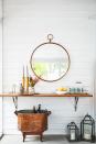 <p>Mirrors have a way of making even the smallest spaces look way bigger. Hang a mirror on your house's exterior to brighten your patio, deck or backyard space. </p>