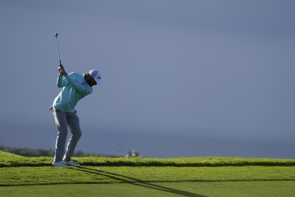 Max Homa hits his third shot on the 14th hole of the South Course at Torrey Pines during the final round of the Farmers Insurance Open golf tournament, Saturday, Jan. 28, 2023, in San Diego. (AP Photo/Gregory Bull)