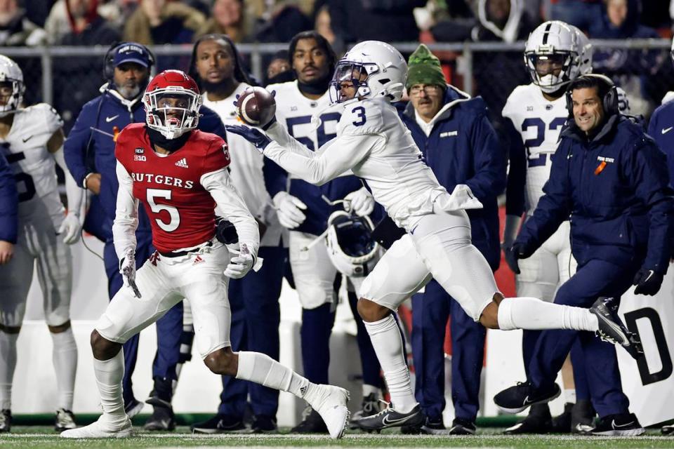 Penn State cornerback Johnny Dixon (3) intercepts the ball in front of Rutgers wide receiver Sean Ryan (5) during the first half of an NCAA college football game Saturday, Nov. 19, 2022, in Piscataway, N.J.