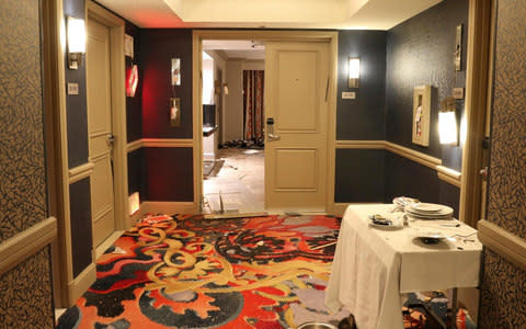 The broken down door to room 32-135 - Credit: Las Vegas Metropolitan Police Department via AP