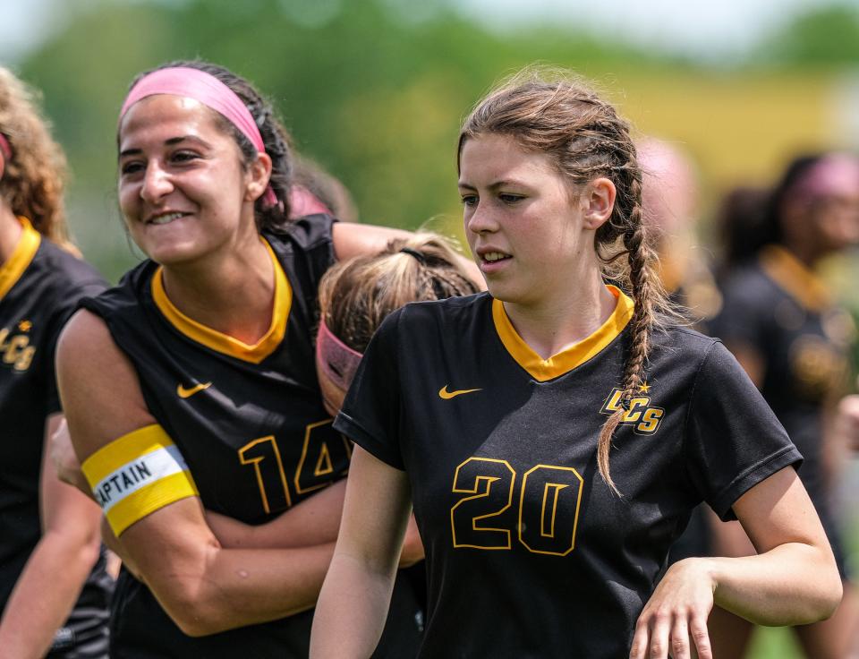 Lansing Christian soccer players celebrate their District Final win over Jackson Lumen Christi 2-0 Saturday, June 4, 2022.