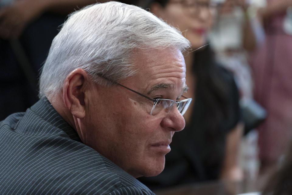 FILE - In this June 15, 2021, file photo Sen. Bob Menendez, D-N.J., listens as Vice President Kamala Harris speaks about the Deferred Action for Childhood Arrivals (DACA) anniversary in Harris' ceremonial office on the White House complex in Washington. Democratic-led congressional committees are vowing to press President Joe Biden’s administration on what went wrong as the Taliban swept to power in Afghanistan. Menendez, chairman of the Senate Foreign Relations Committee, said lawmakers will investigate what he described as the “Biden administration’s flawed execution of the U.S. withdrawal.” (AP Photo/Jacquelyn Martin, File)