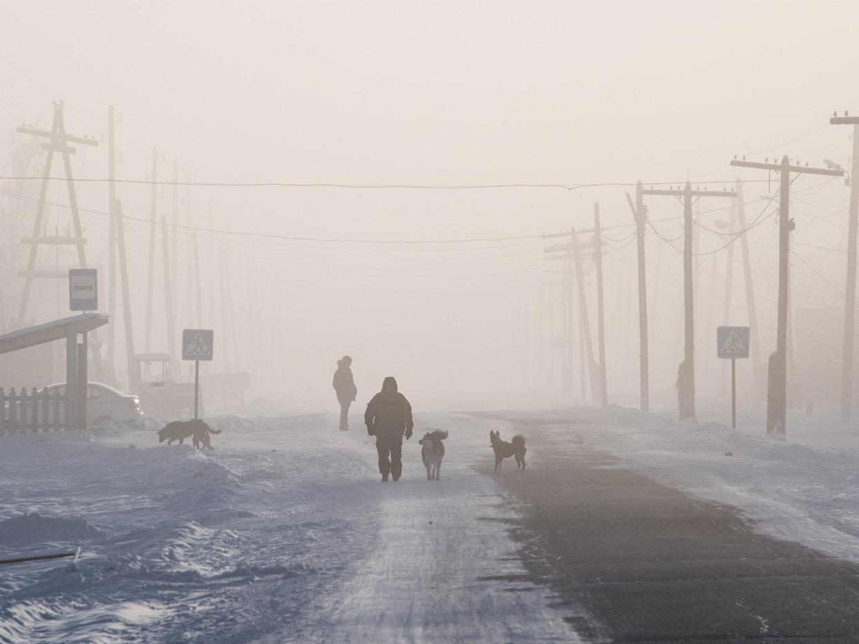 A man walks on the main street of the settlement of Oy, south of Yakutsk, with the air temperature at about minus 41C: Getty