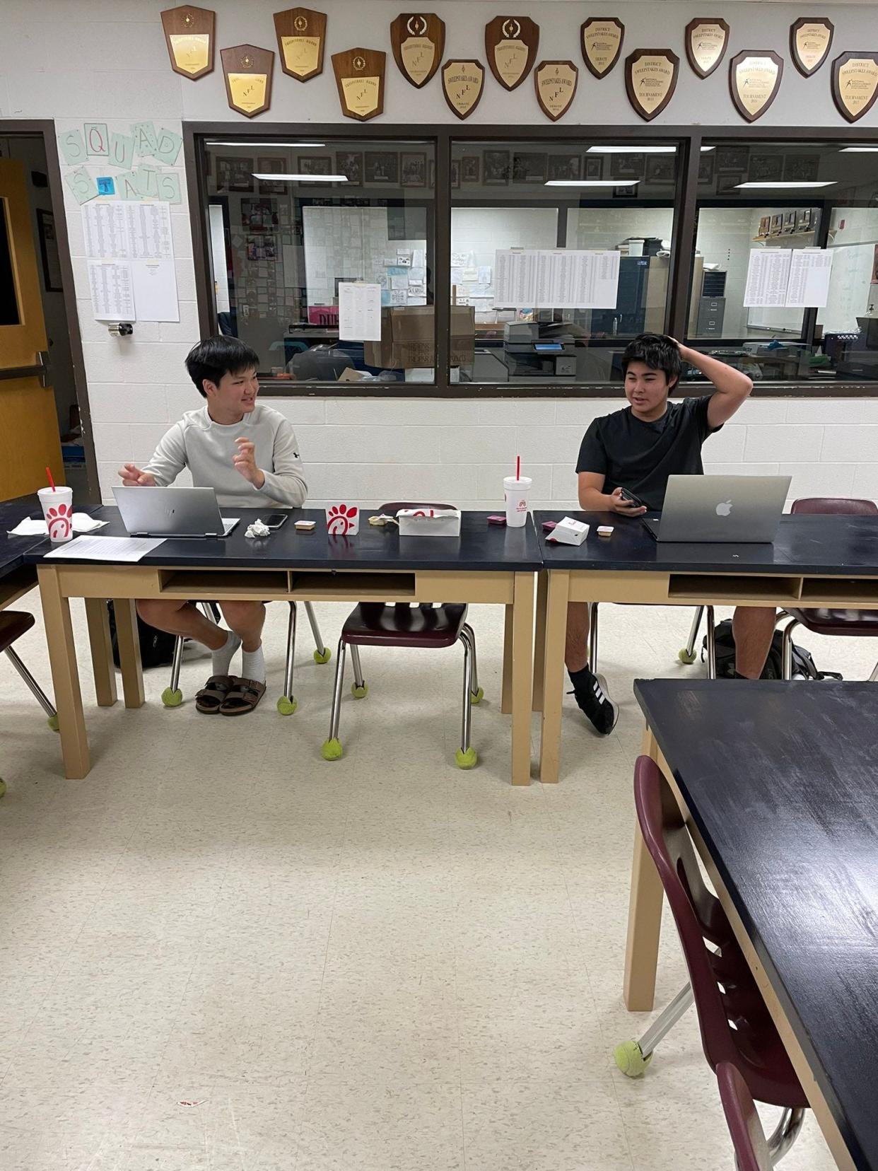 Washburn Rural High School senior debaters Jinyoon Park and Zach Willingham hang out between rounds of the National Debate Coaches Association tournament in April. The pair were the overall winners of that tournament.