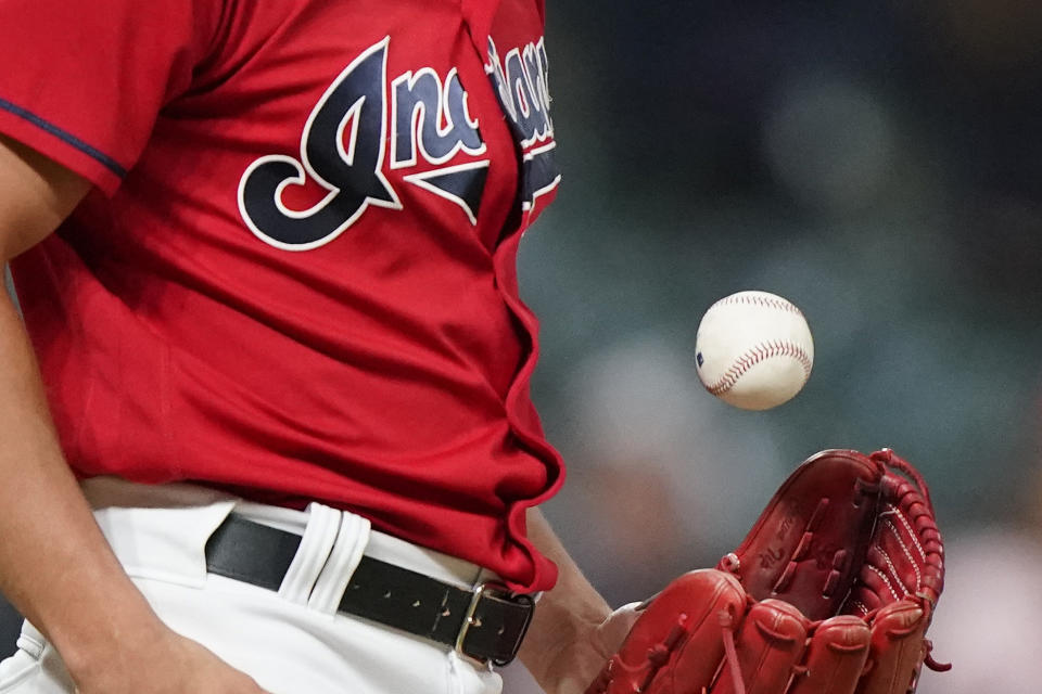 Cleveland Indians relief pitcher James Karinchak tosses the ball between pitches during the eighth inning of the team's baseball game against the Baltimore Orioles, Tuesday, June 15, 2021, in Cleveland. (AP Photo/Tony Dejak)