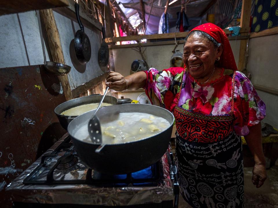 Magdalena Martinez, a local island resident, cooks at her house on Carti Sugtupu.